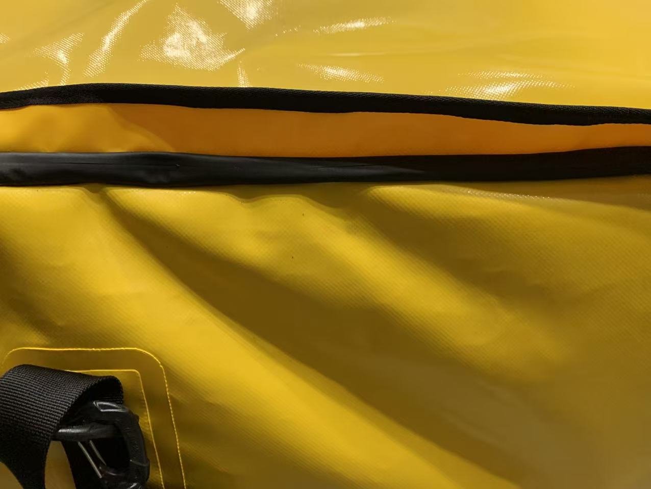 Close-up of RF-welded anchor points and non-reflective stealth hardware on an OEM tactical dry bag. Close-up of RF-welded anchor points and non-reflective stealth hardware on an OEM tactical dry bag.